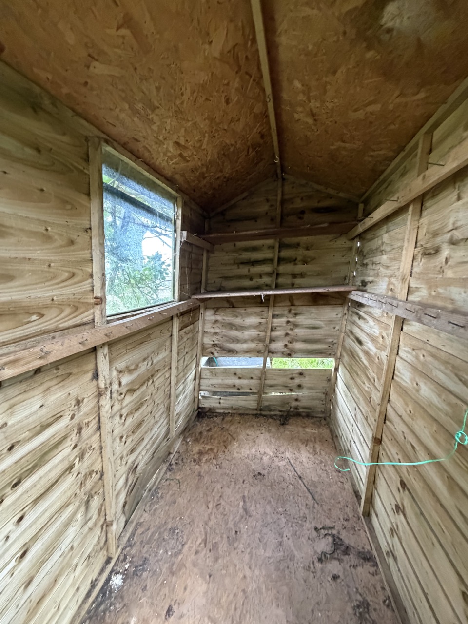 Photograph of internal view of a lilting garden shed